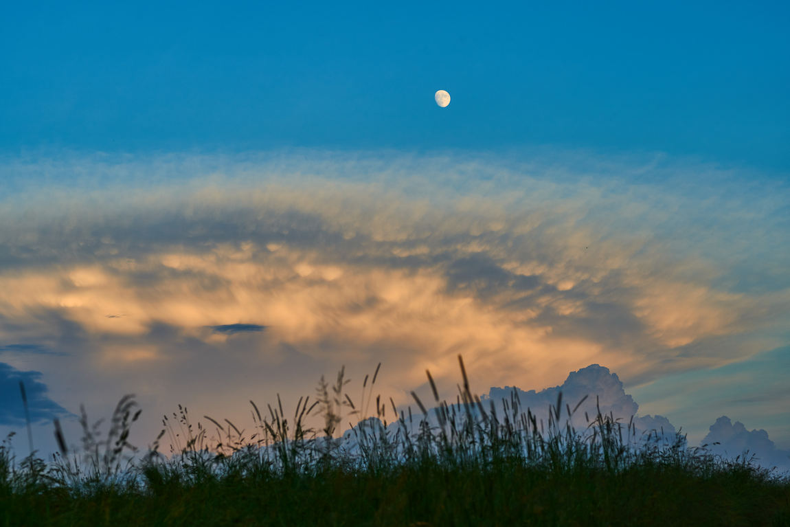 moon over pecular cloud formation