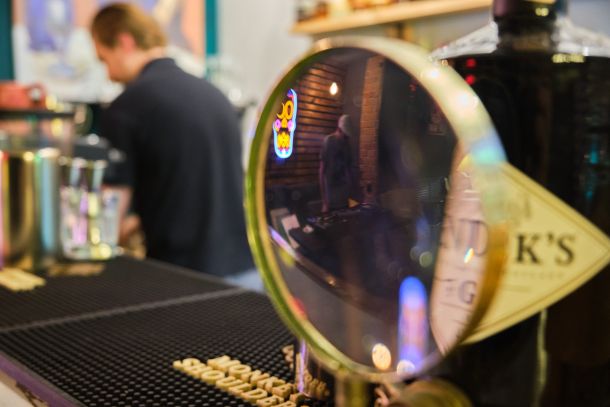 a bartender and the magnifying glass