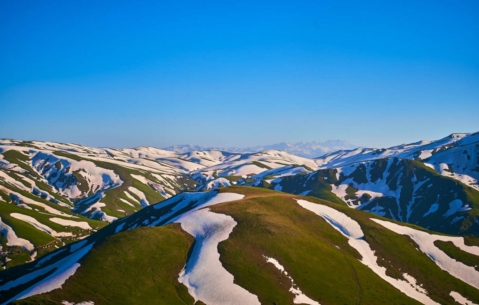 view to the mountains partially in snow