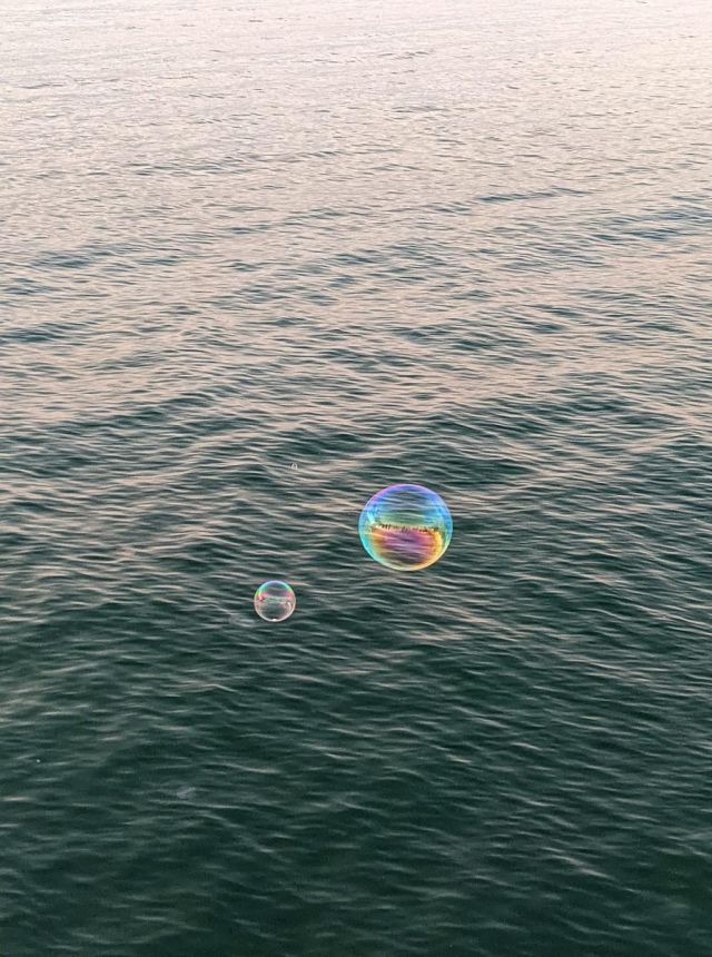 a soap bubble over the sea