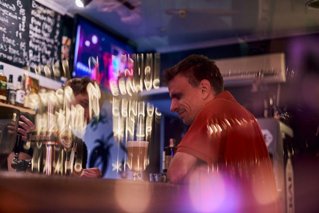 a man in the bokeh reflection