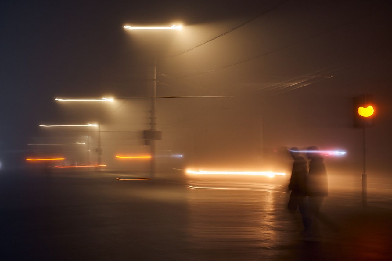 abstract photo of people on foggy night