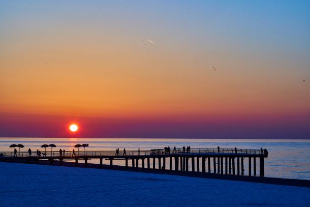 winter view to the pier at the sunset